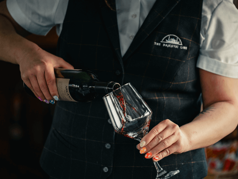 Waiter pouring window into glass