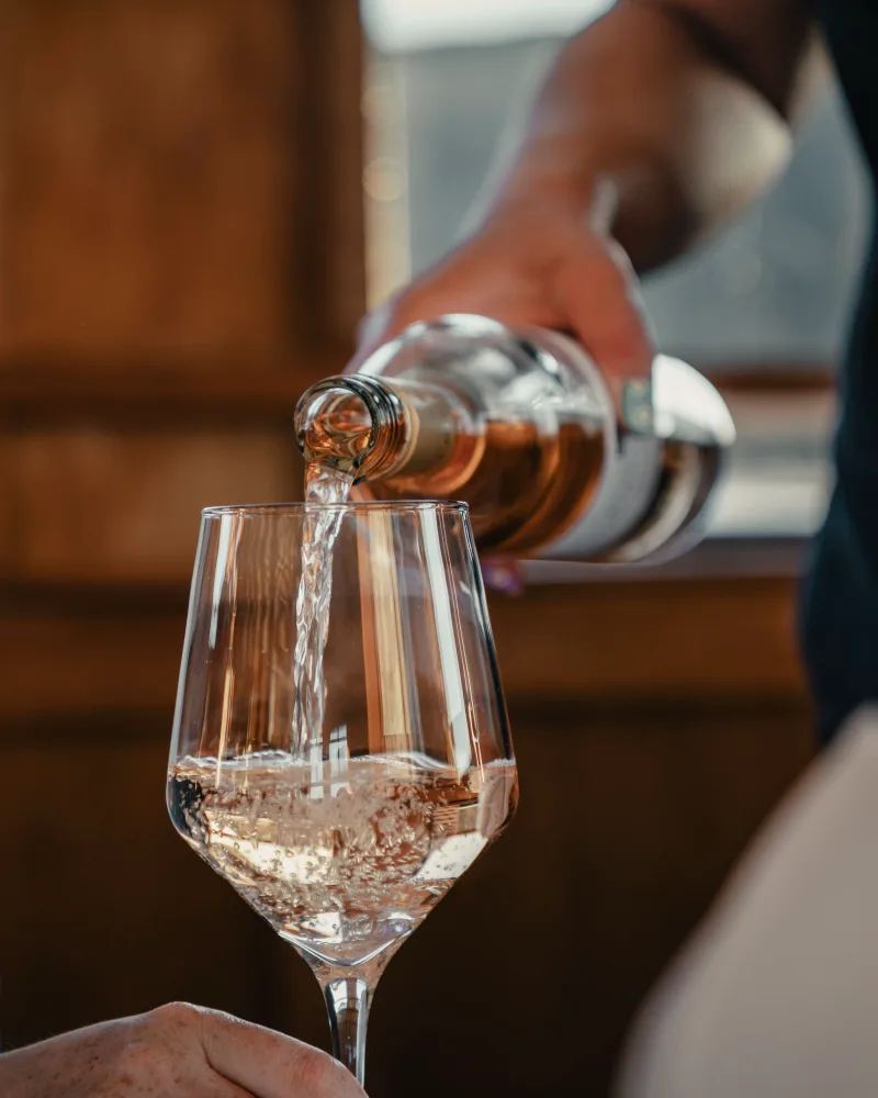 Wine being poured into a glass