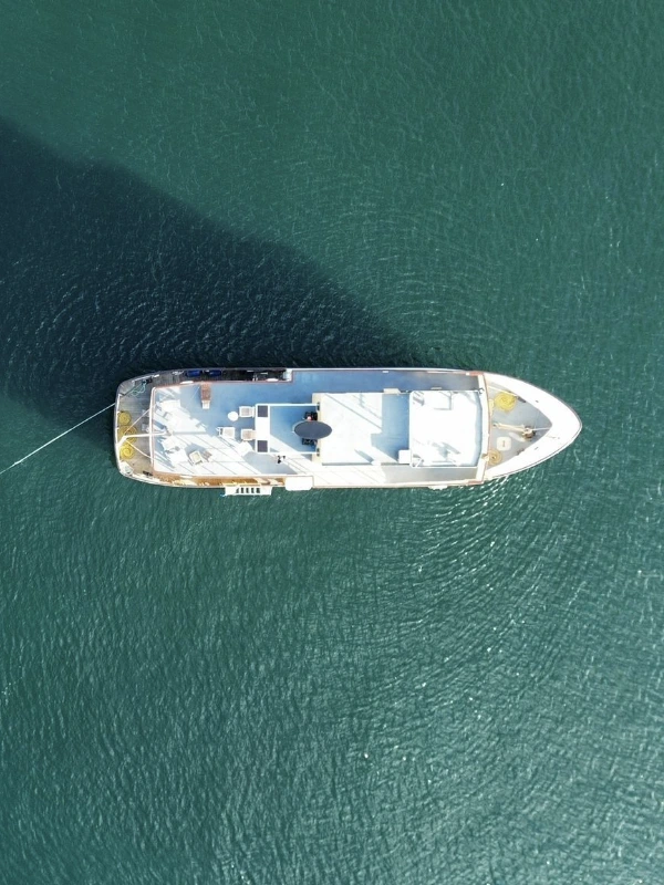 Aerial view of one of our boats in clear blue waters